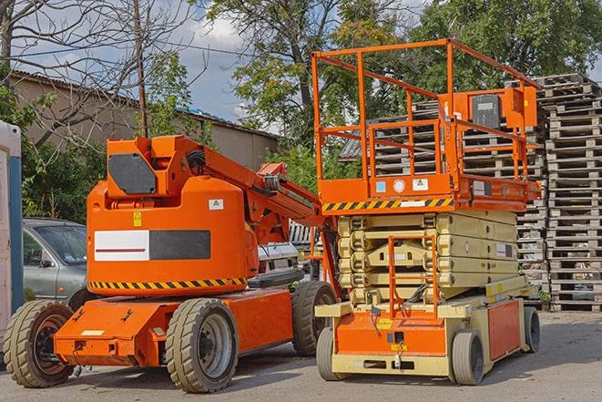 forklift moving crates in a large warehouse in Aurora